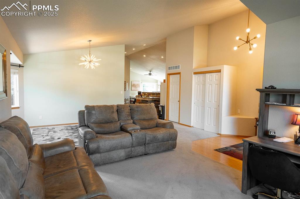 Image 5 of 37: View looking from living through dining to kitchen.