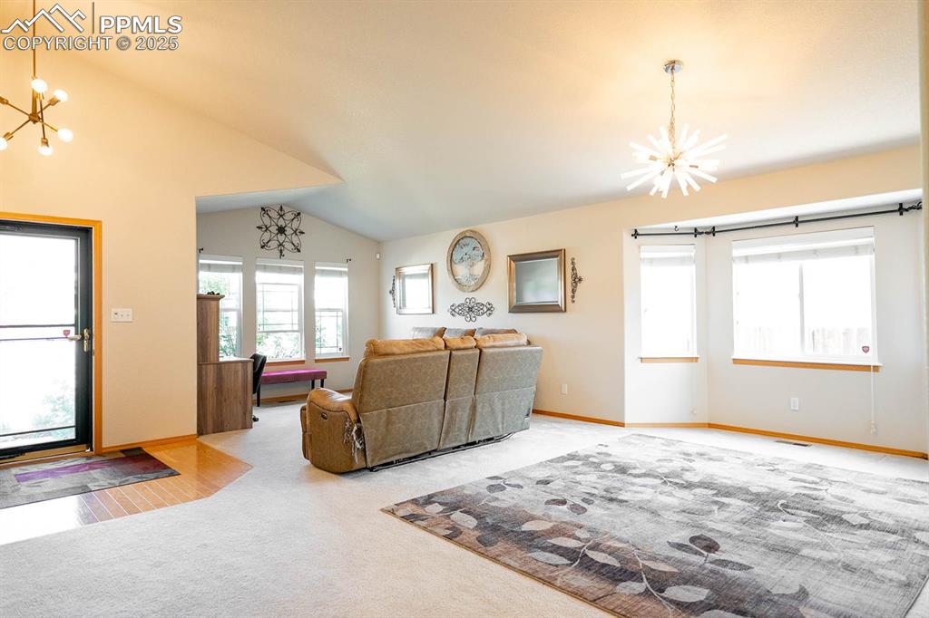 Image 6 of 37: Notice all the windows? Dining area looking towards the front of the home.