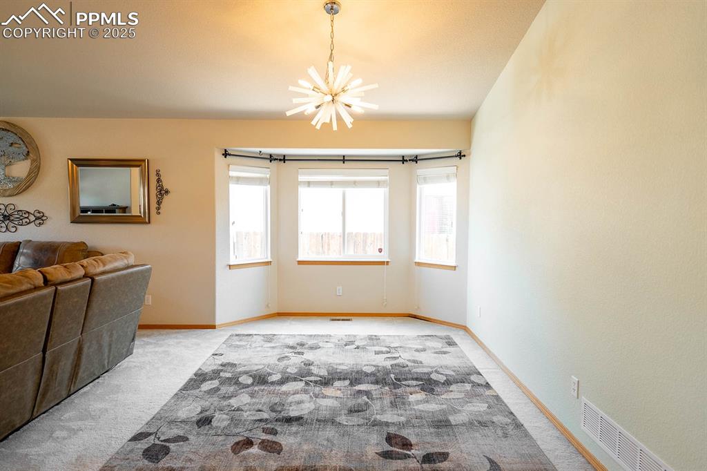 Image 8 of 37: Good size room will fit a large table