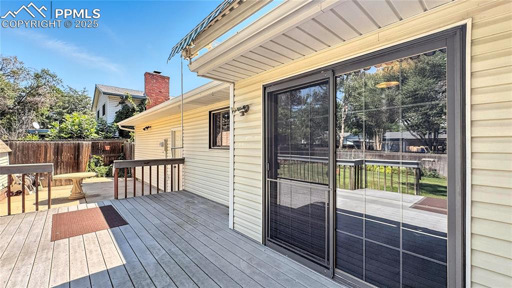 Image 10 of 50: Back entrance to the dining room and entrance to the garage from the patio