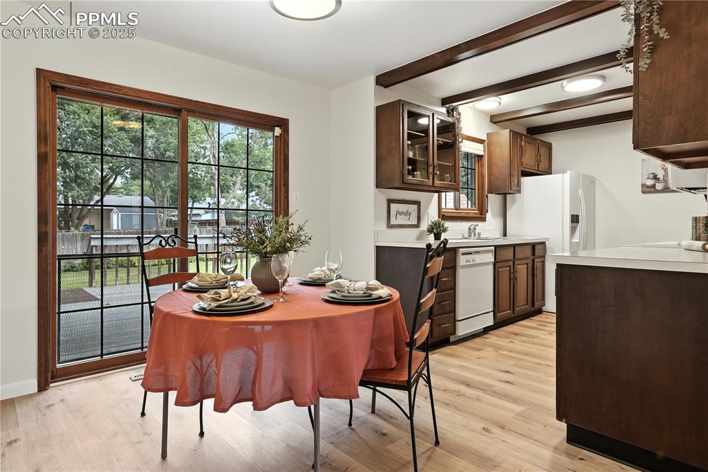 Image 12 of 50: Dining area flows into the kitchen