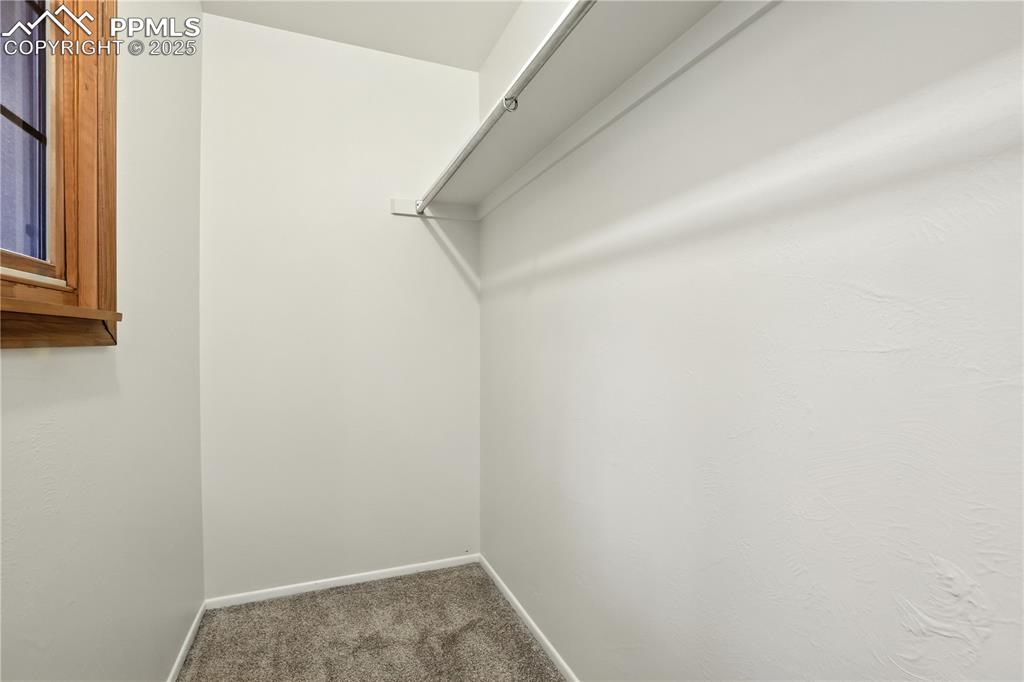 Image 20 of 50: Walk-in closet with a window for natural light