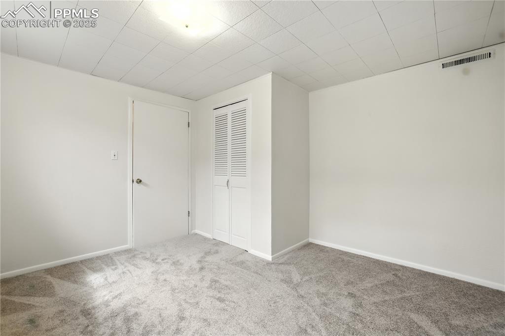 Image 33 of 50: Forth Bedroom features fresh paint and new carpet