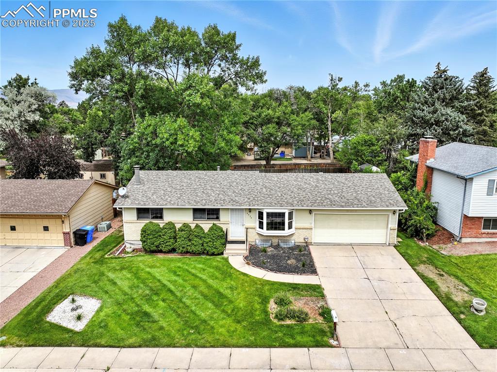Image 49 of 50: Front view of this charming well-maintained home