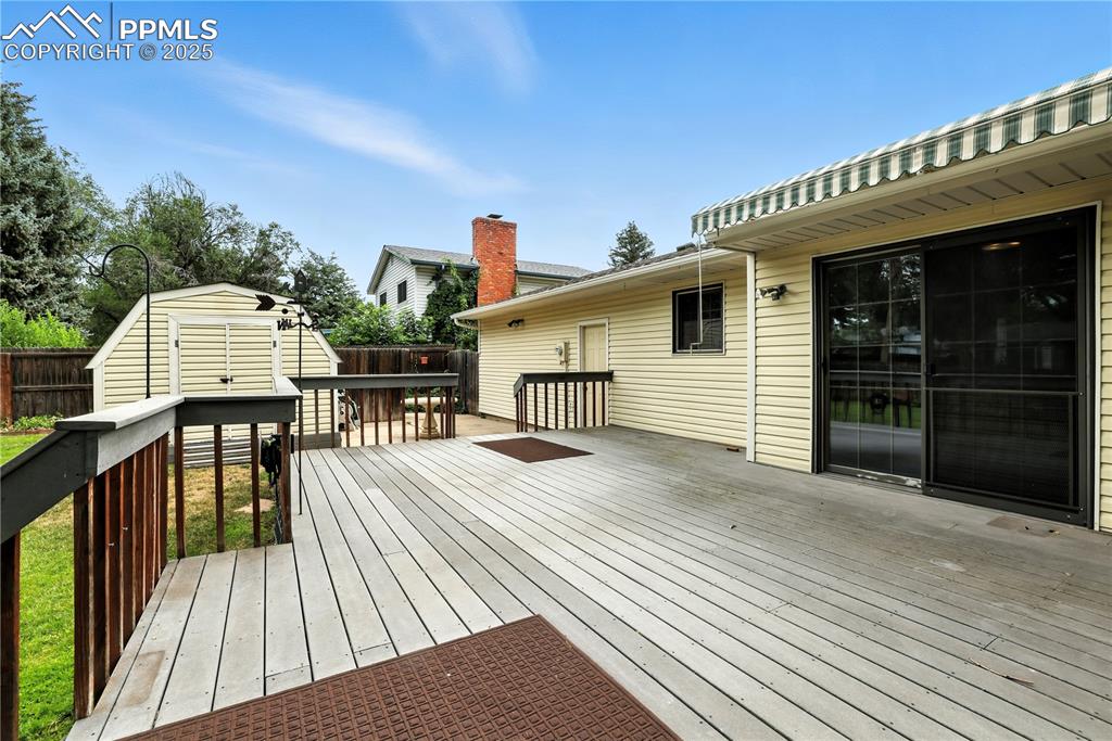 Image 8 of 50: Huge deck with retractable awning!