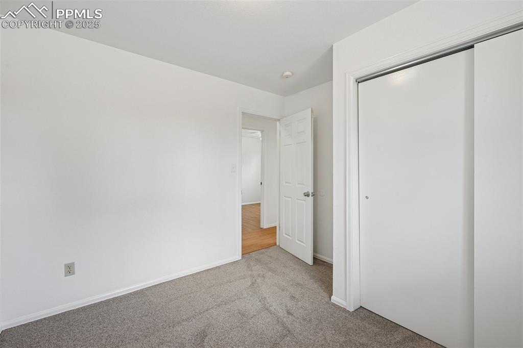 Image 17 of 35: Unfurnished bedroom featuring carpet flooring and a closet