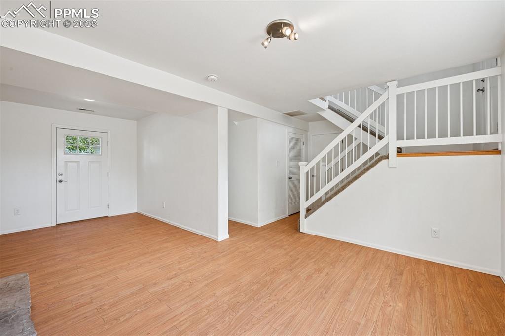 Image 19 of 35: Entrance foyer featuring light wood-type flooring and stairway