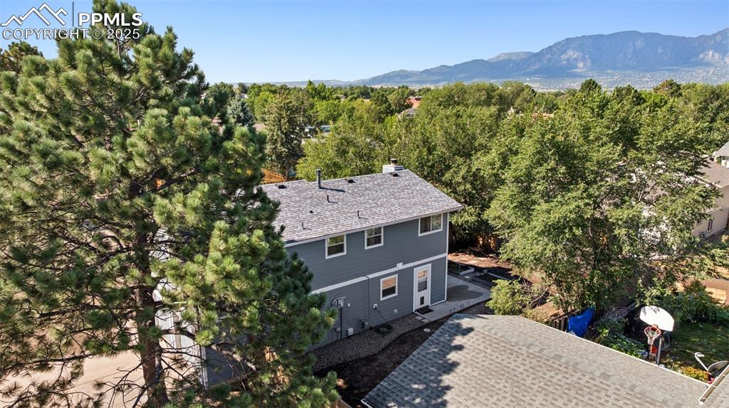 Image 30 of 35: Aerial view of property and surrounding area with a mountain backdrop