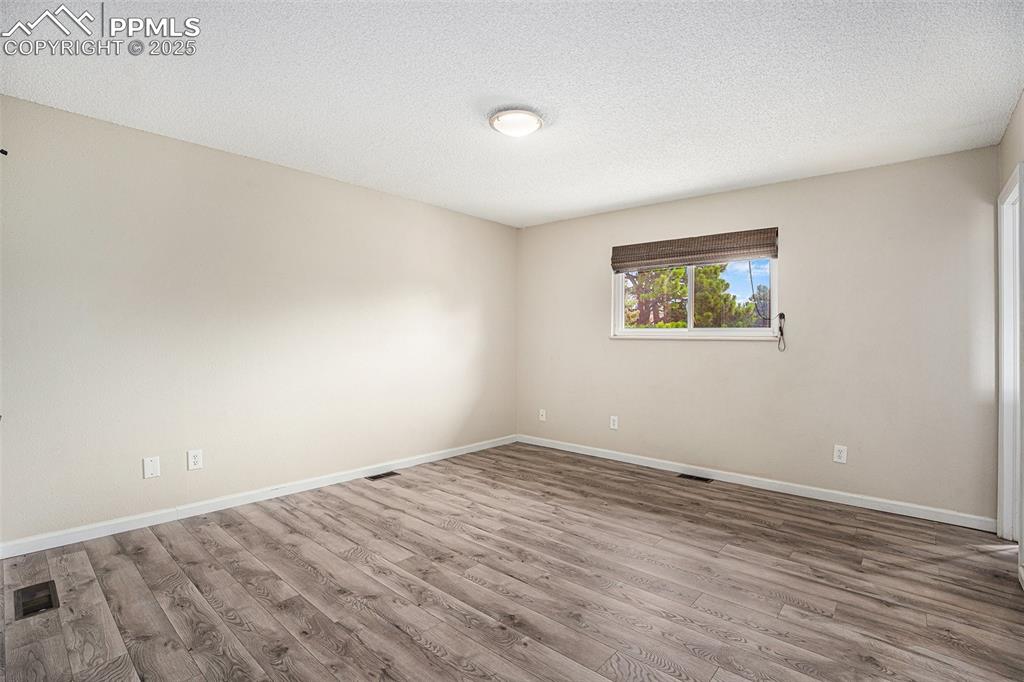 Image 11 of 31: Primary bedroom with walk in closet and attached bath