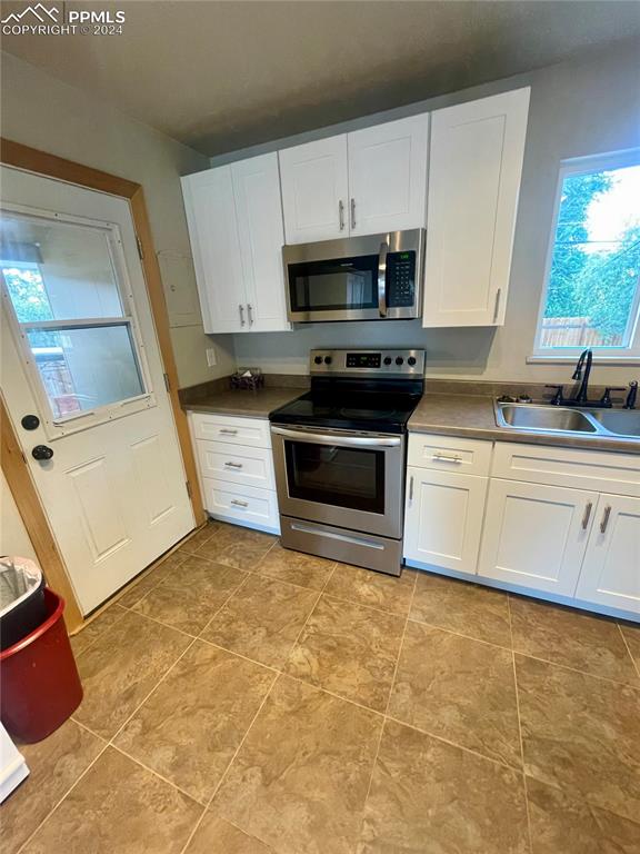 Image 11 of 47: Another view of Kitchen.