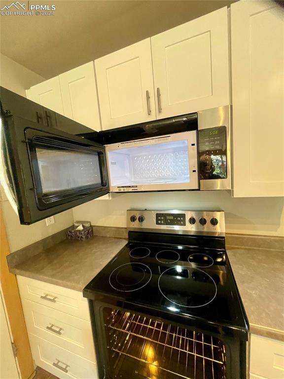 Image 15 of 47: Stainless steel appliances microwave oven.