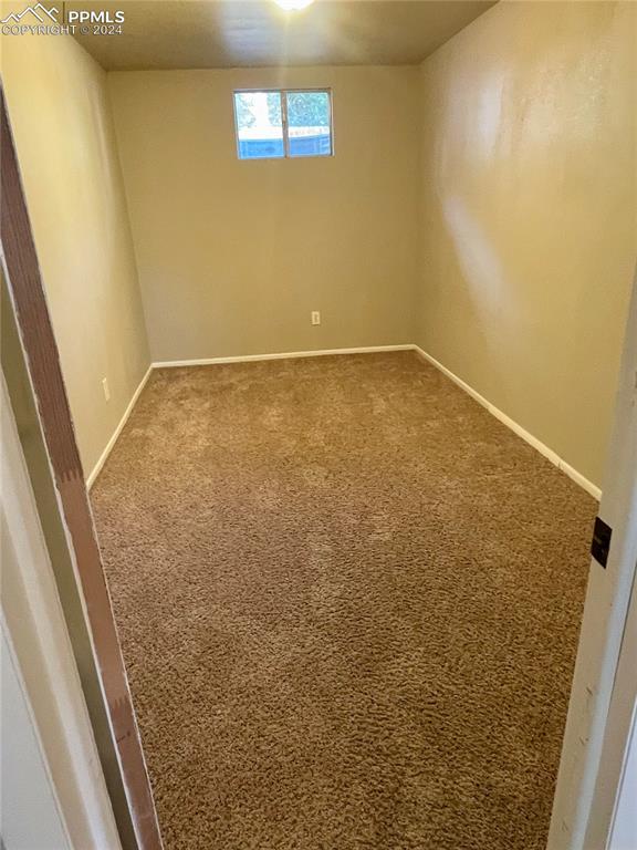 Image 26 of 47: Bedroom 4 is in the Basement. Carpet flooring