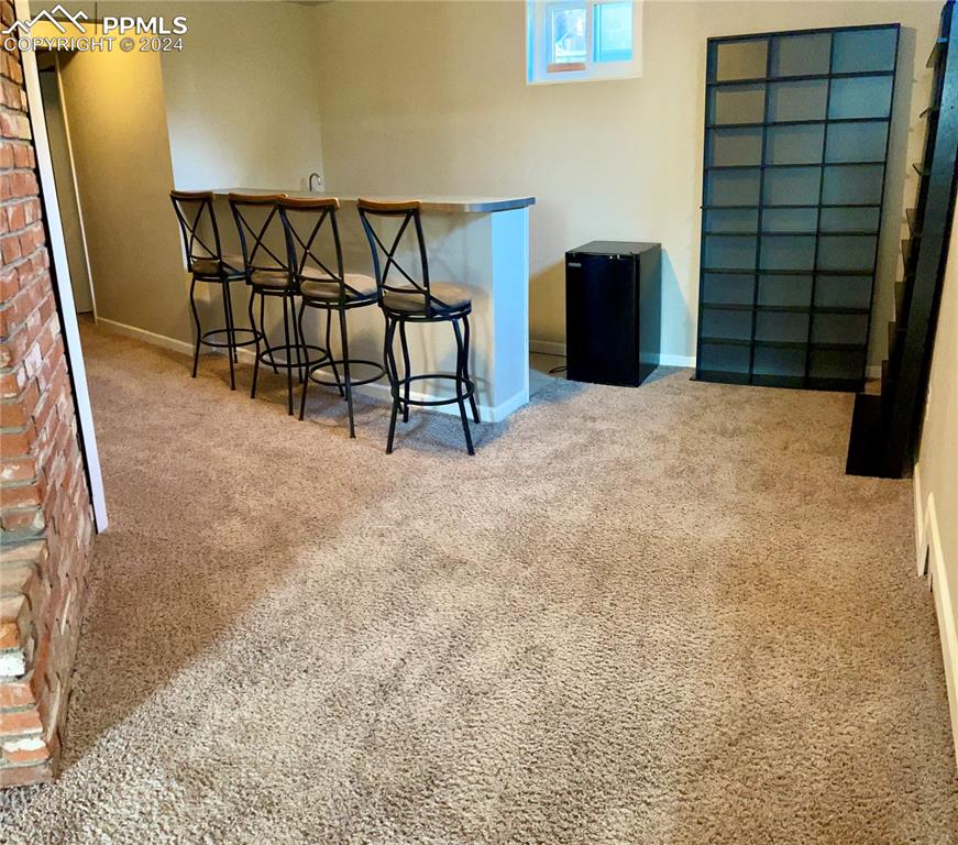 Image 28 of 47: View of wet bar area.