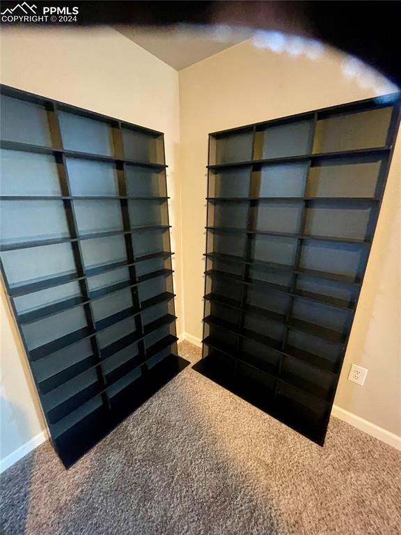 Image 33 of 47: Shelving next to Basement Wet Bar stay. Great for your collectbles.
