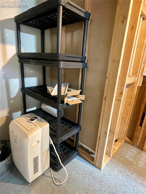 Image 36 of 47: Lots of storage and shelving in Utility/Laundry area