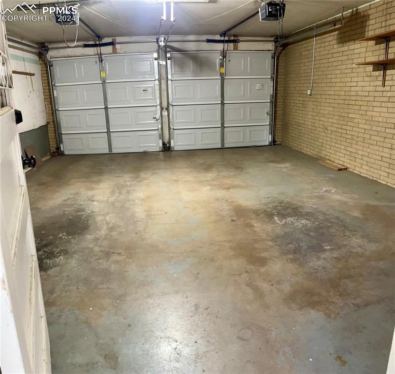 Image 43 of 47: Oversize Garage featuring with 2 GDO