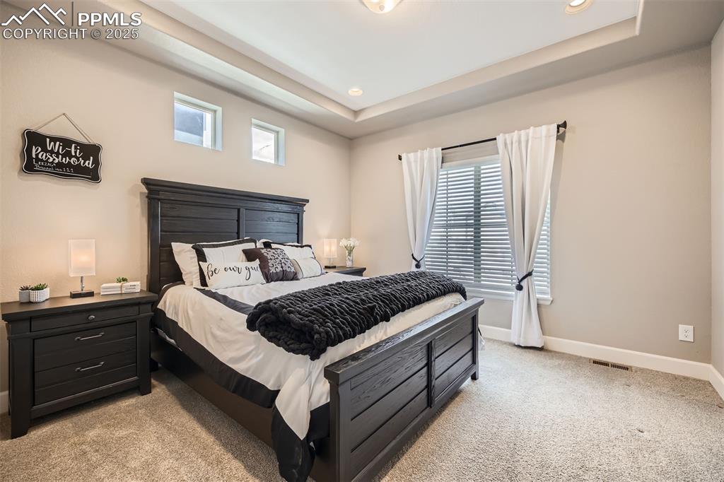 Image 14 of 30: Primary suite on main floor with en suite bath