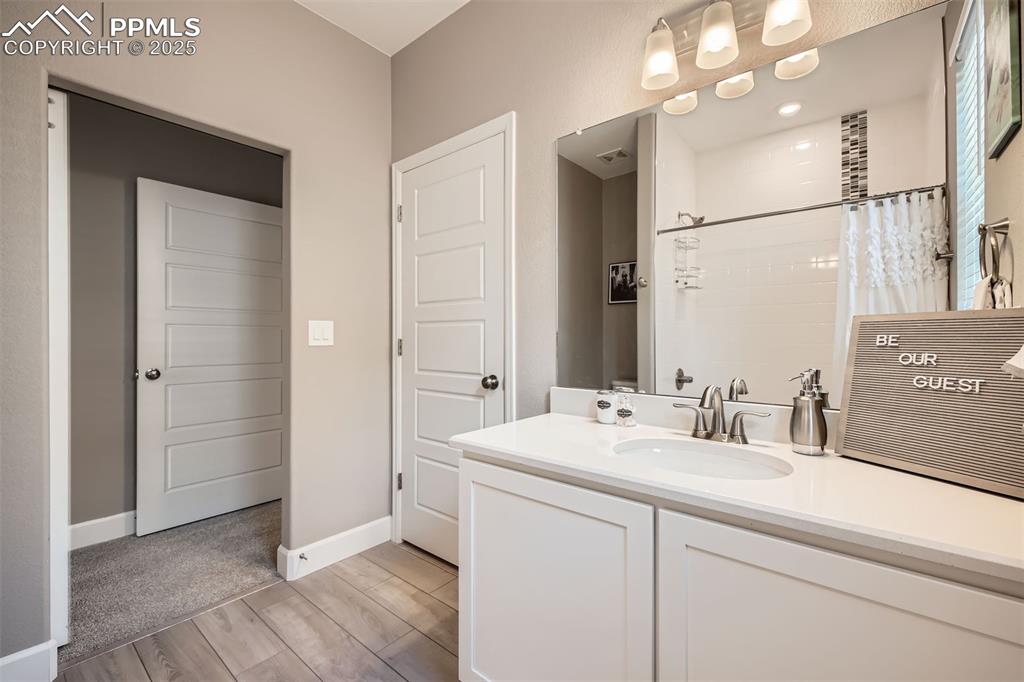 Image 15 of 30: Full bath adjacent to primary on main floor