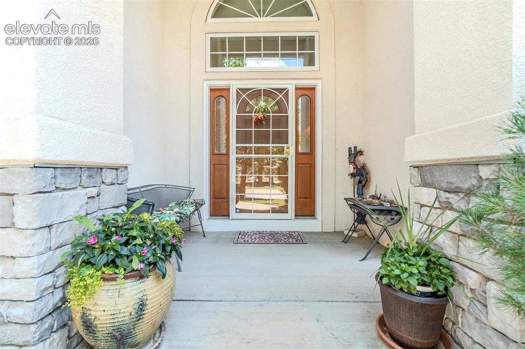 Image 3 of 47: Covered Entryway featuring a beautiful glass security door