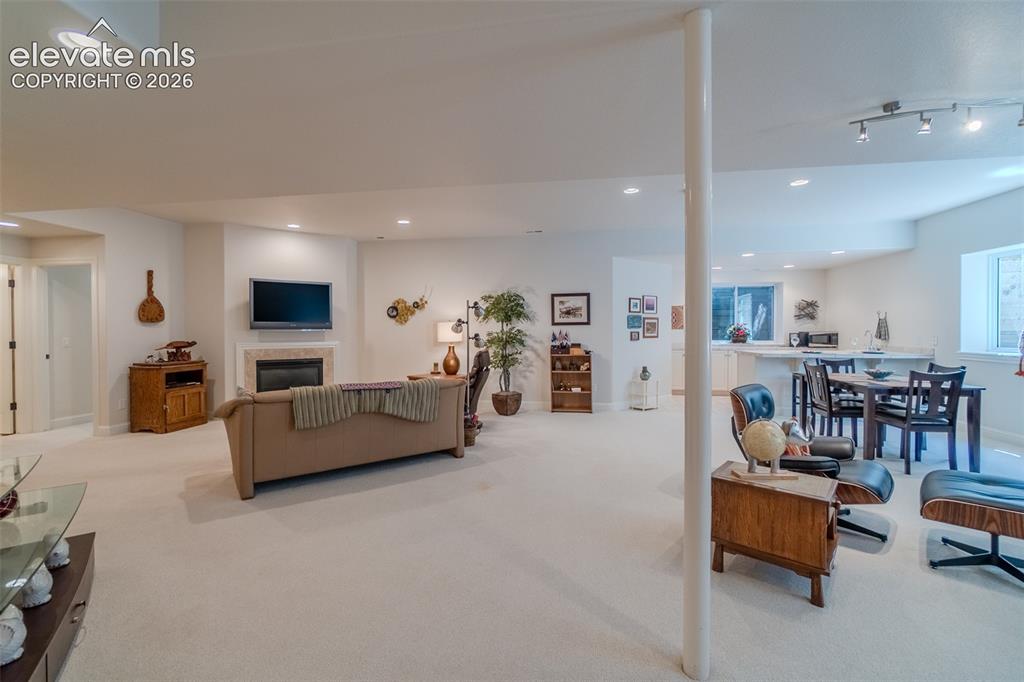 Image 32 of 47: Spacious lower level featuring light-toned carpeting, recessed lighting, an