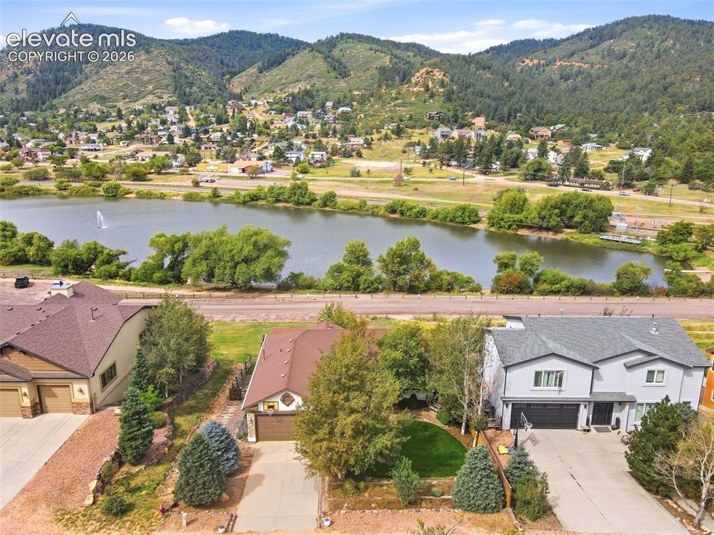 Caption: Stucco walkout ranch home backing to Plamer Lake!