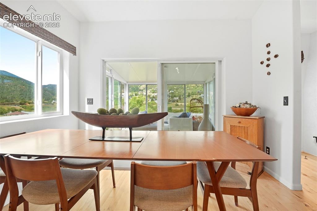 Image 17 of 49: Bright interior with wood-finish flooring and white walls