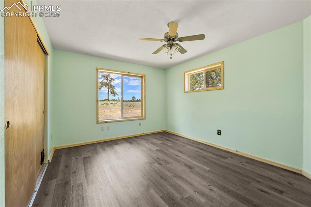 Image 11 of 34: Main level guest bedroom