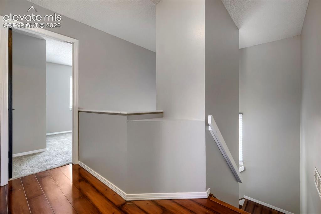 Image 12 of 28: Stairs and landing with view to below.