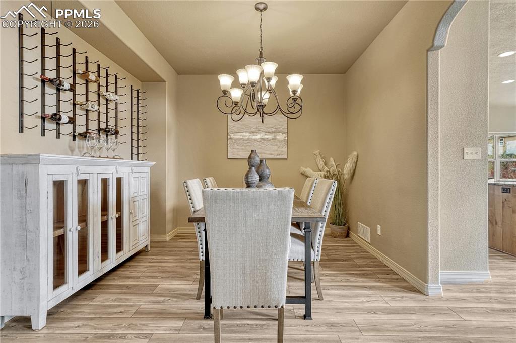 Image 11 of 50: Host unforgettable dinners in the formal dining room, which seamlessly conn