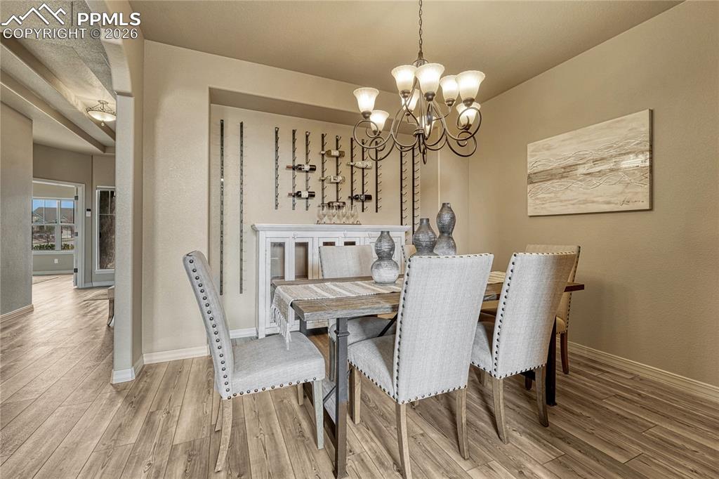 Image 12 of 50: With plenty of room for a large table and an elegant recessed wall perfect 