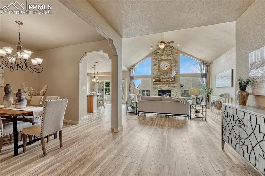 Image 13 of 50: Step into the breathtaking great room where vaulted ceilings and a stunning
