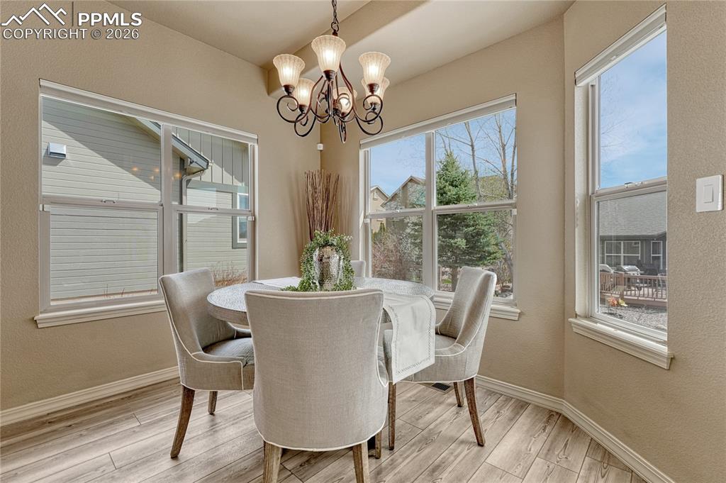 Image 22 of 50: Enjoy your morning coffee in the sun-drenched breakfast nook, surrounded by