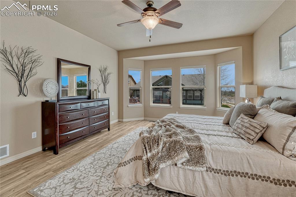 Image 27 of 50: Beautiful bay windows in the primary suite provide an ideal reading nook an