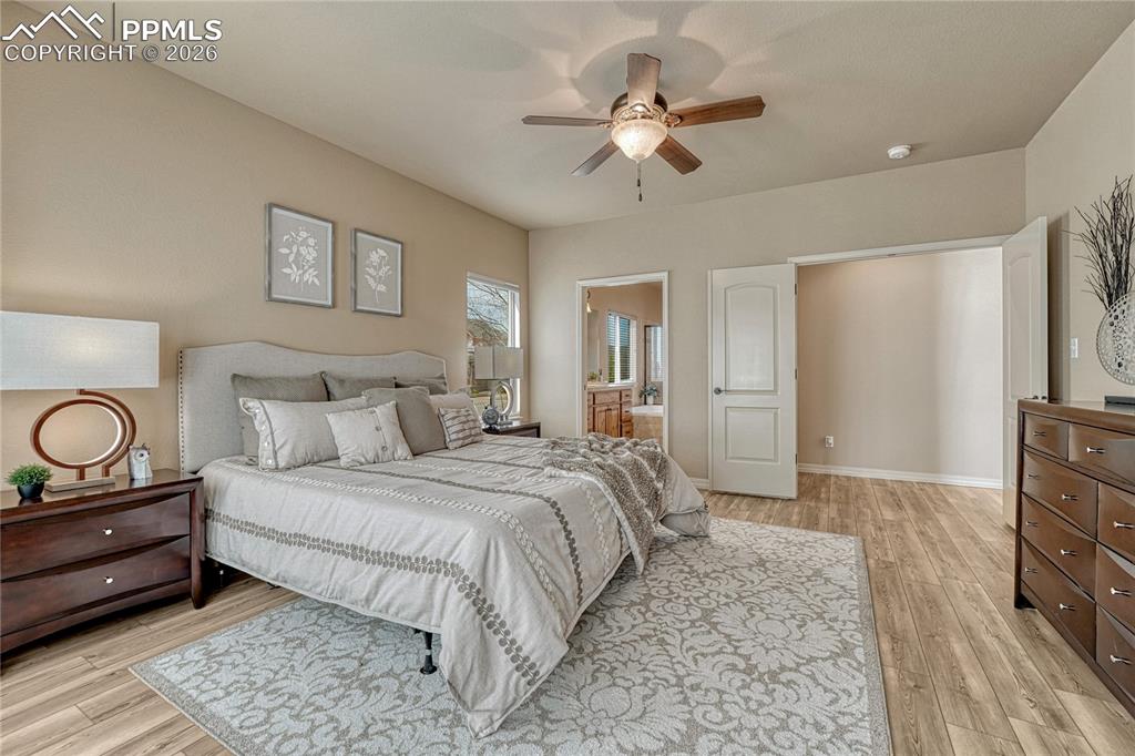 Image 28 of 50: This private primary suite is generously sized and conveniently flows right