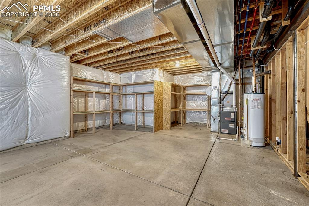 Image 38 of 50: Never run out of space with this oversized storage room, featuring extensiv