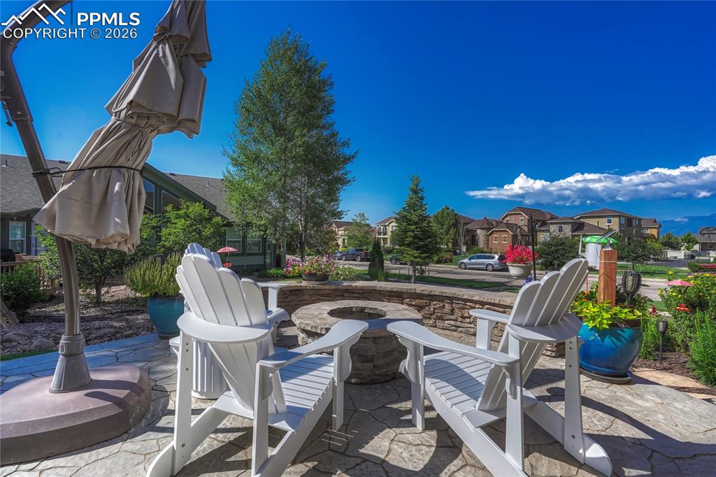 Image 40 of 50: The built-in fire pit is the perfect gathering spot for roasting marshmallo