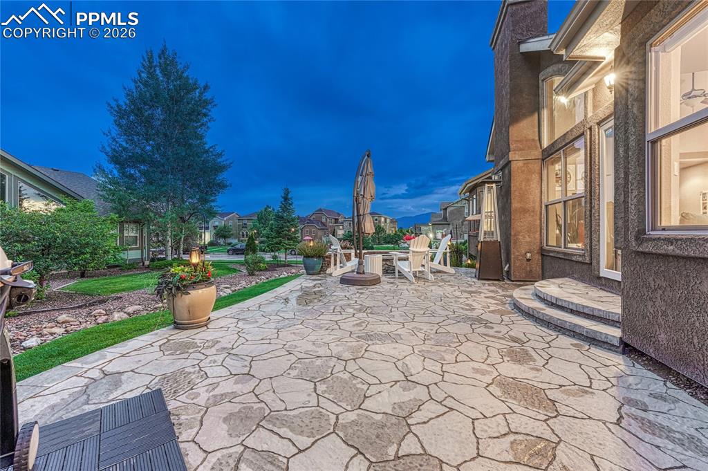 Image 42 of 50: Relax on the back patio and admire the mountain view and meticulously maint