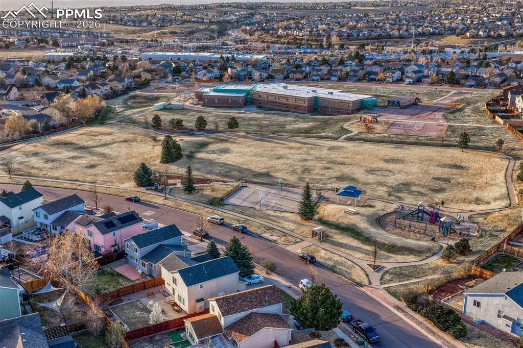 Image 19 of 46: One street behind your new home is a playground, basketball, pavilion and s