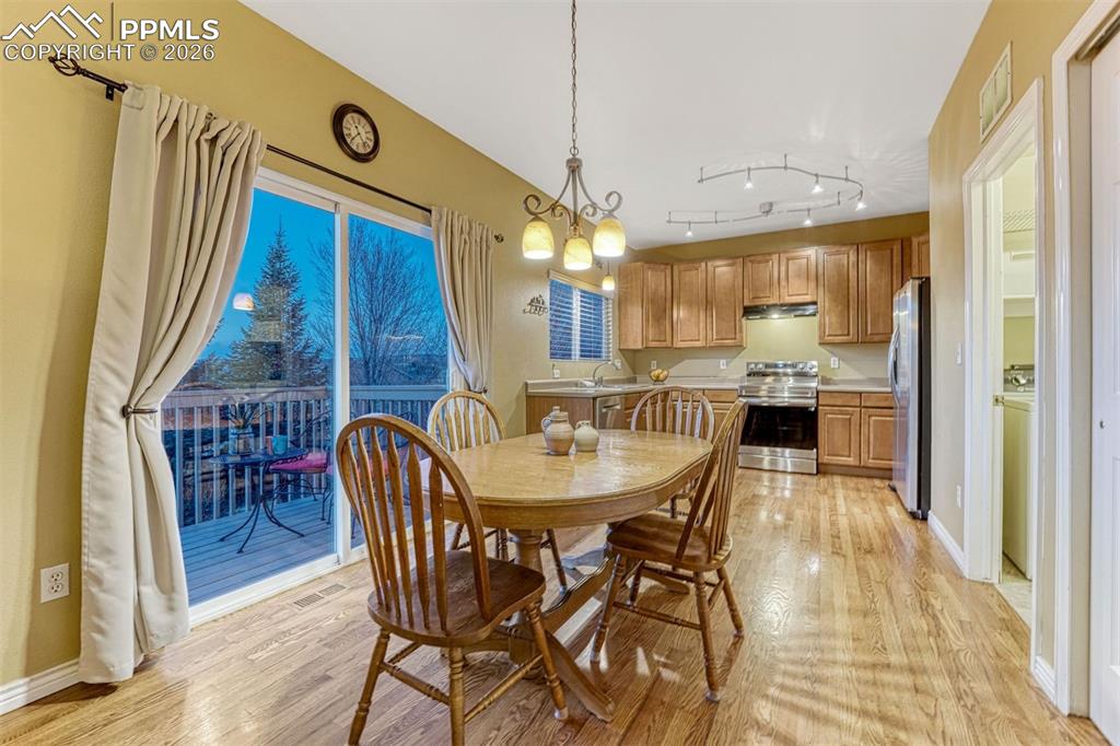 Image 26 of 46: Spacious dining flows seamlessly into your kitchen to make for functional e