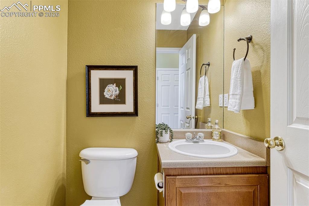 Image 28 of 46: Main level half bath