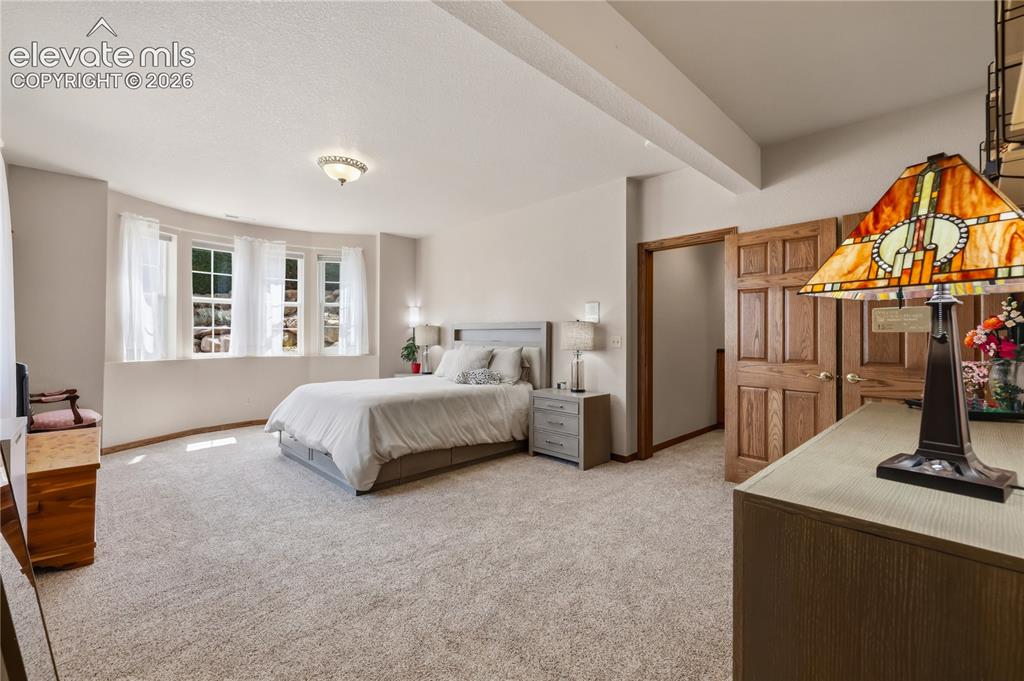 Image 34 of 49: Junior Suite - Recessed ceiling and tray ceiling details, light-colored car