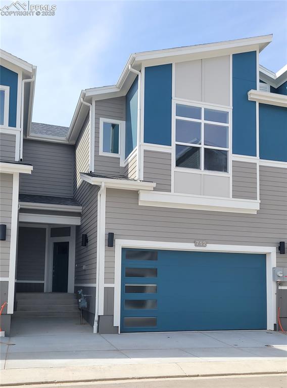 Image 1 of 36: Mountain View-Modern Elevation-Covered Entry-2 Car Garage-Finished Walk Out