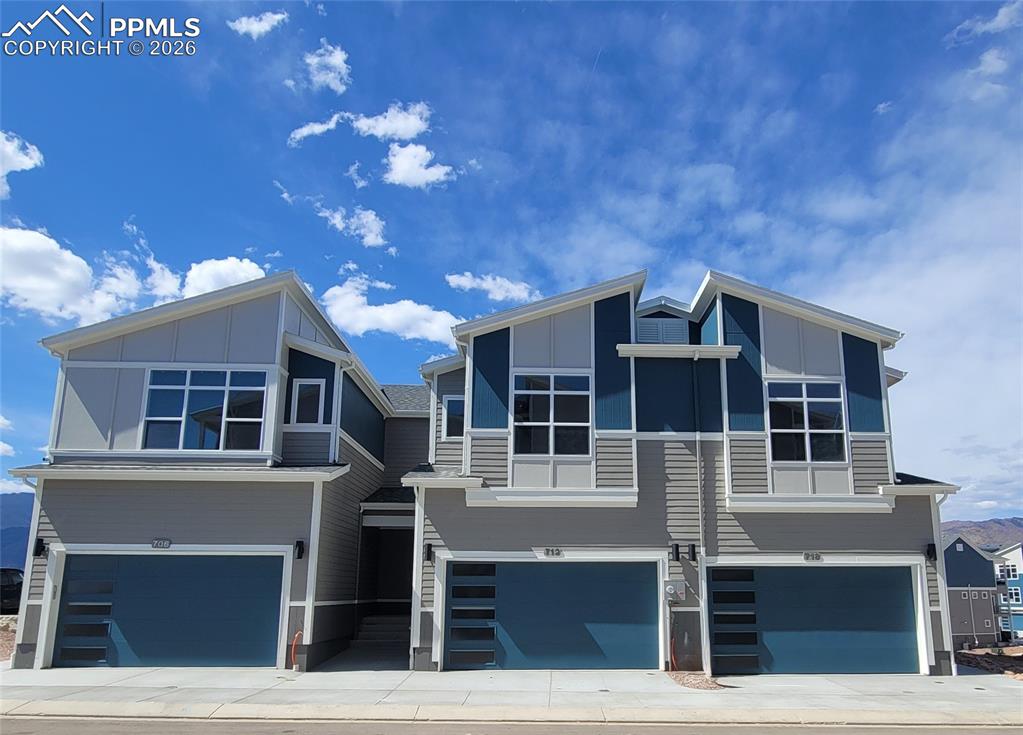 Image 2 of 36: Mountain View-Modern Elevation-Covered Entry-2 Car Garage-Finished Walk Out