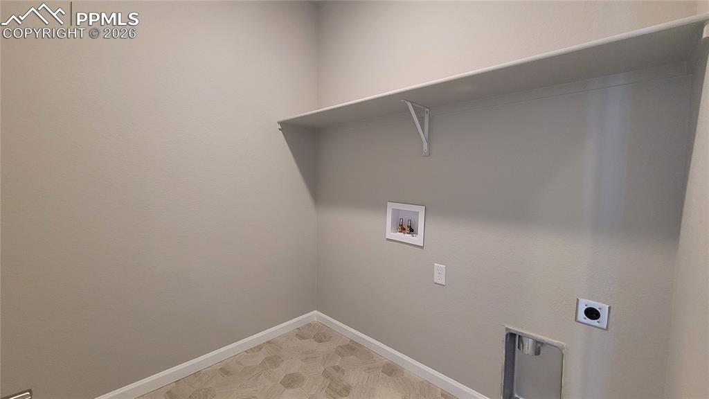 Image 21 of 36: Laundry room conveniently located on the upper level! 