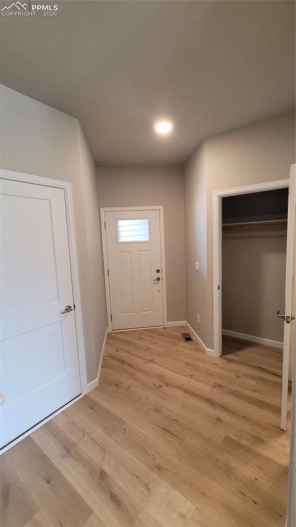 Image 3 of 36: Welcome Home! Inviting Entryway with LVP flooring, coat closet, and garage 