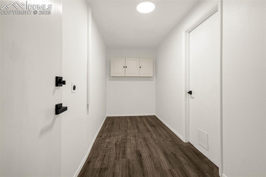 Image 15 of 27: Basement Laundry room with access to the garage