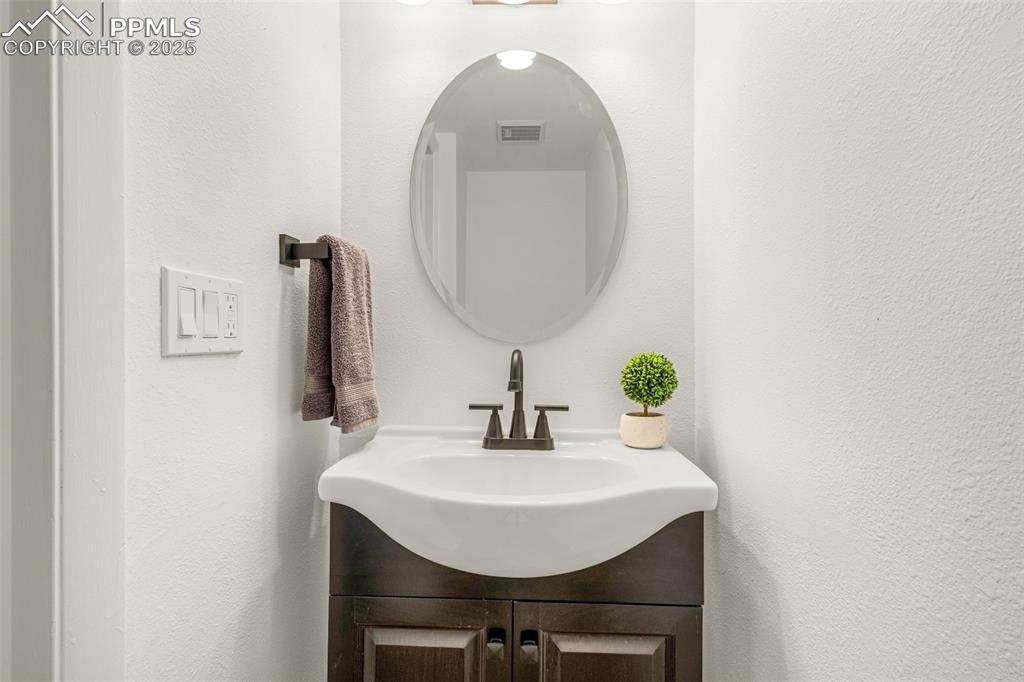Image 7 of 27: Bathroom featuring vanity