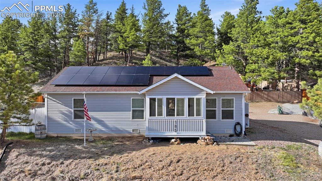 Image 1 of 28: Ranch-style residence featuring horizontal siding, a covered entry porch, a