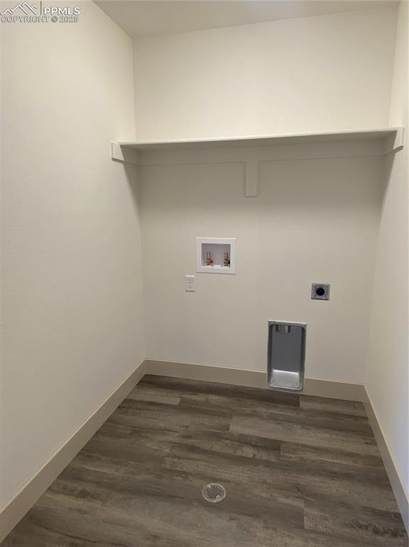 Image 15 of 35: Laundry room with dark wood finished floors, electric dryer hookup, and hoo