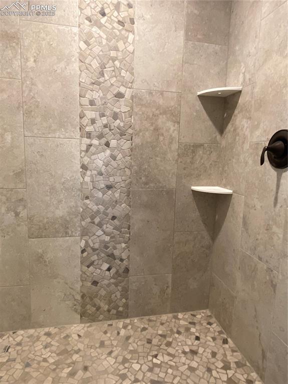 Image 21 of 35: Bathroom view of tiled shower